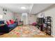 Finished basement with a colorful rug, comfortable sofa, and plenty of space for activities at 8746 Sunridge Hollow Rd, Parker, CO 80134
