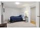 Cozy bedroom with a plush bed, carpet, closet, and stylish bedside table at 8746 Sunridge Hollow Rd, Parker, CO 80134