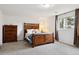 Cozy bedroom featuring a rustic wood bed frame and dresser at 8746 Sunridge Hollow Rd, Parker, CO 80134