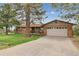 Charming home featuring a well-maintained lawn, a spacious driveway, and an attached two-car garage at 8746 Sunridge Hollow Rd, Parker, CO 80134