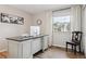 Bright home office with a large desk, comfortable chair, and natural light at 8746 Sunridge Hollow Rd, Parker, CO 80134