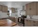 Modern kitchen with wood countertops and stainless steel appliances at 1131 S Raleigh St, Denver, CO 80219