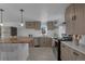 Modern kitchen featuring wood countertops and stainless steel appliances at 1131 S Raleigh St, Denver, CO 80219