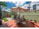 Backyard patio area, perfect for outdoor dining, with an umbrella and a grill at 616 W 1St Ave, Denver, CO 80223