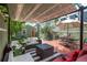 Backyard patio area features a gazebo, outdoor seating and a built-in grill at 616 W 1St Ave, Denver, CO 80223