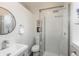 Clean, modern bathroom with glass shower, sleek fixtures, and white subway tile at 616 W 1St Ave, Denver, CO 80223