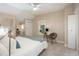 Bright bedroom with plush carpeting, neutral colors, and a ceiling fan at 616 W 1St Ave, Denver, CO 80223