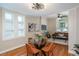 Dining room features hardwood floors, a glass table with seating, and modern decor at 616 W 1St Ave, Denver, CO 80223