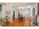 Dining room features a glass table, hardwood floors, and easy access to the kitchen at 616 W 1St Ave, Denver, CO 80223