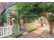 Charming home with well-maintained yard, and a inviting front porch at 616 W 1St Ave, Denver, CO 80223