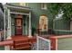 Charming front porch with seating, well-maintained exterior, and inviting curb appeal at 616 W 1St Ave, Denver, CO 80223