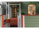 Charming front porch with covered entrance, colorful exterior, and inviting curb appeal at 616 W 1St Ave, Denver, CO 80223