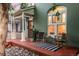 Inviting front porch with seating and charming exterior at 616 W 1St Ave, Denver, CO 80223