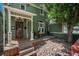 Charming home featuring a cozy front porch and unique rock landscaping at 616 W 1St Ave, Denver, CO 80223