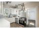 Bright kitchen featuring white cabinets, modern appliances, and striking tile flooring at 616 W 1St Ave, Denver, CO 80223