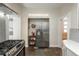 Modern kitchen features stainless steel appliances and white subway tile at 616 W 1St Ave, Denver, CO 80223