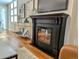 Cozy living room featuring hardwood floors, a modern fireplace, and stylish decor at 616 W 1St Ave, Denver, CO 80223