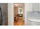 Open-concept living area featuring hardwood floors and ample natural light from large windows at 616 W 1St Ave, Denver, CO 80223