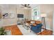 Cozy living room with hardwood floors, a plush rug, and a large window at 616 W 1St Ave, Denver, CO 80223