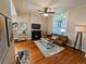 Inviting living room features a cozy fireplace and large window with lots of natural light at 616 W 1St Ave, Denver, CO 80223