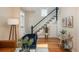 Cozy living room featuring hardwood floors and a staircase at 616 W 1St Ave, Denver, CO 80223