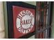 Historic Baker District sign attached to an iron gate at 616 W 1St Ave, Denver, CO 80223