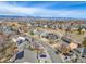 View of a two-story home with solar panels in a neighborhood with mountain views at 730 Pope Dr, Erie, CO 80516