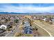 View of two-story homes in a neighborhood with mountain views and walking path at 730 Pope Dr, Erie, CO 80516