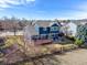 Two-story home with a wooden deck, fenced yard, patio, and landscaping at 730 Pope Dr, Erie, CO 80516