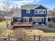 Two-story home with a wooden deck, fenced yard, patio, and landscaping at 730 Pope Dr, Erie, CO 80516