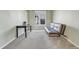 Bedroom featuring a futon sofa, small desk, a window, light green walls and neutral carpeting at 730 Pope Dr, Erie, CO 80516