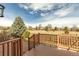 Inviting wooden deck overlooking a grassy lawn and surrounding neighborhood, perfect for outdoor relaxation and entertaining at 730 Pope Dr, Erie, CO 80516