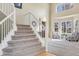 Welcoming foyer with soaring ceilings, lots of natural light, and a view of the staircase at 730 Pope Dr, Erie, CO 80516