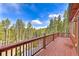 Spacious outdoor deck showcasing beautiful views and ample room for entertaining at 100 Apache Rd, Evergreen, CO 80439