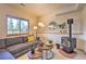 Comfortable living room showcasing modern lighting and a decorative fireplace at 100 Apache Rd, Evergreen, CO 80439