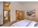 Bright main bedroom featuring an ensuite bathroom, closet, and closet at 100 Apache Rd, Evergreen, CO 80439