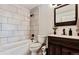 Modern bathroom with subway tile and dark wood vanity at 9530 E Florida Ave # 2001, Denver, CO 80247