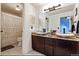 Bathroom with double sinks and separate shower area at 9530 E Florida Ave # 2001, Denver, CO 80247