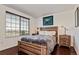 Bedroom with hardwood floors and large window for natural light at 9530 E Florida Ave # 2001, Denver, CO 80247