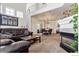 Spacious living room featuring a fireplace, open floor plan, and a lovely staircase at 9530 E Florida Ave # 2001, Denver, CO 80247