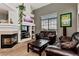 Cozy living room with fireplace and comfortable seating at 9530 E Florida Ave # 2001, Denver, CO 80247