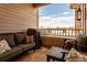 Cozy covered patio furnished with comfortable seating and a grill, perfect for outdoor relaxing at 9530 E Florida Ave # 2001, Denver, CO 80247