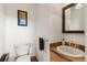 Half bathroom featuring modern fixtures, stylish mirror, and sleek design at 72 Overlook Ct, Idaho Springs, CO 80452
