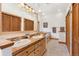 Bathroom featuring double sinks, tile floors, and a separate tub at 72 Overlook Ct, Idaho Springs, CO 80452