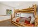 Rustic bedroom with unique log bunk beds and a cozy, inviting atmosphere at 72 Overlook Ct, Idaho Springs, CO 80452