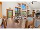 Cozy dining area connected to living room, featuring a wooden table and chairs and lots of natural light at 72 Overlook Ct, Idaho Springs, CO 80452