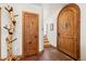 Hallway with a unique log coat rack and decorative wood doors at 72 Overlook Ct, Idaho Springs, CO 80452
