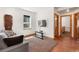 Cozy living room featuring a comfortable sofa and a view of the bathroom at 72 Overlook Ct, Idaho Springs, CO 80452