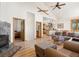 Inviting living room with hardwood floors, fireplace, and open floor plan to kitchen and dining area at 72 Overlook Ct, Idaho Springs, CO 80452