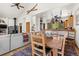 Open concept living and dining area with hardwood floors and rustic decor connected to kitchen at 72 Overlook Ct, Idaho Springs, CO 80452